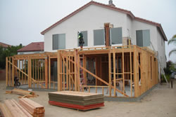 Construction of an additional room added to the exterior of a home.